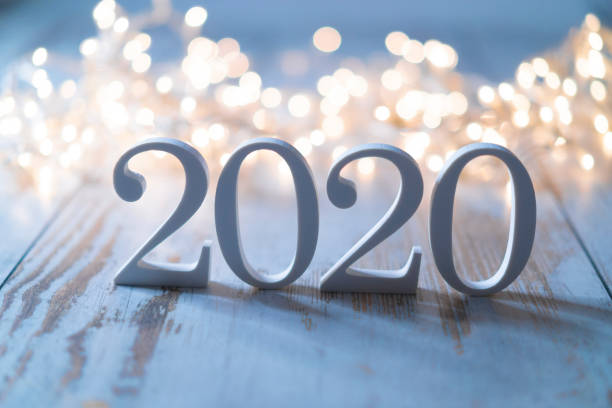 2020 in cut out letters against pretty lights