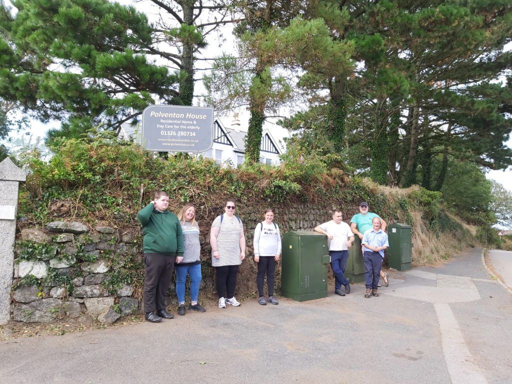 Polventon volunteers outside the tidy front hedge