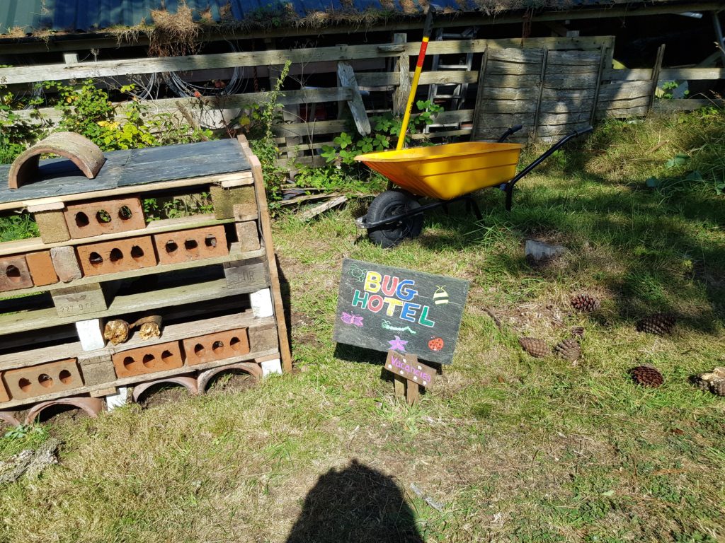 Bug hotel with painted sign, Polventon