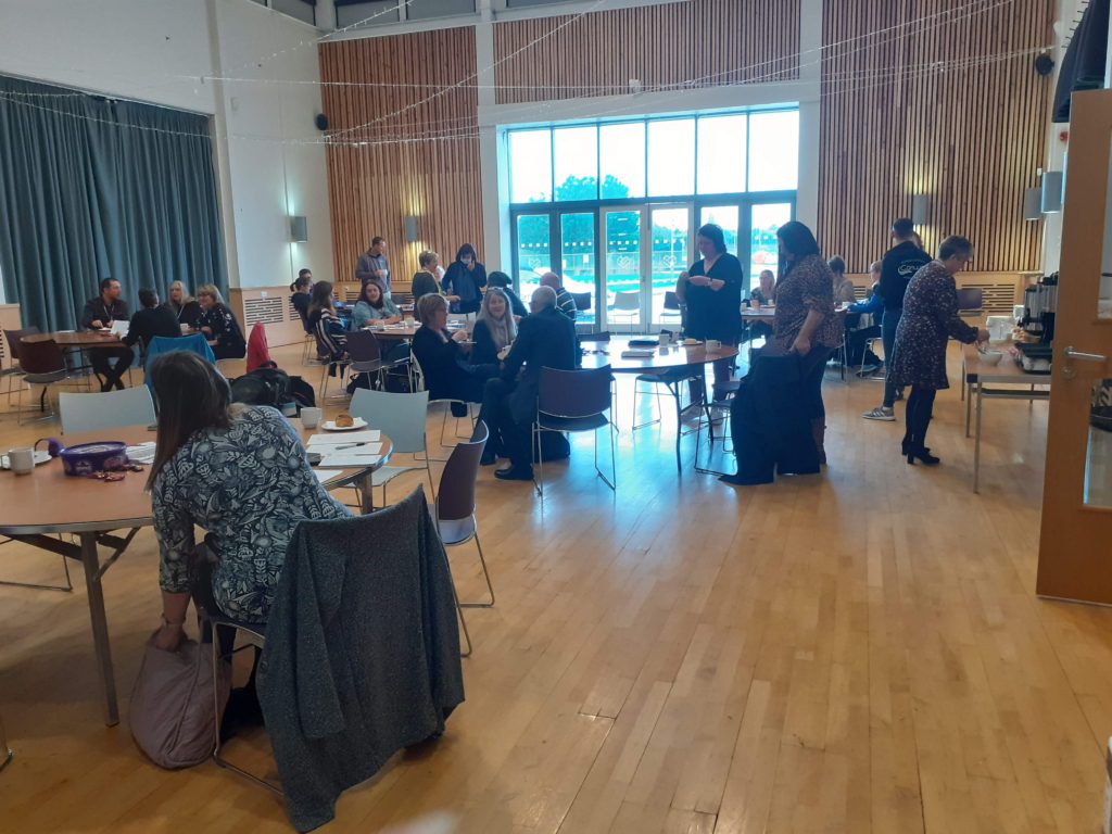 AGM attendees chatting before the meeting
