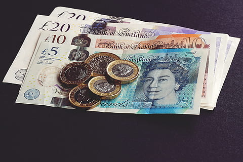 small pile of notes and coins